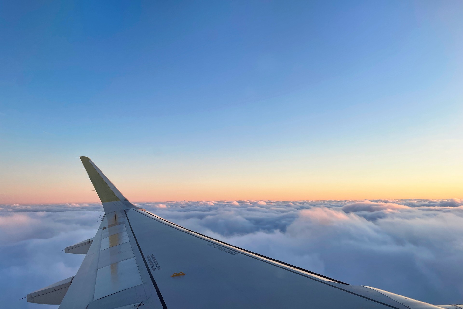 View of the magical clouds at sunset from the airplane window
